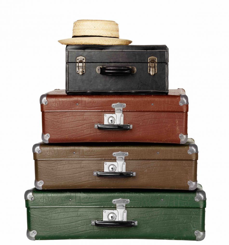 Three Suitcases with Summer Hat isolated on white background